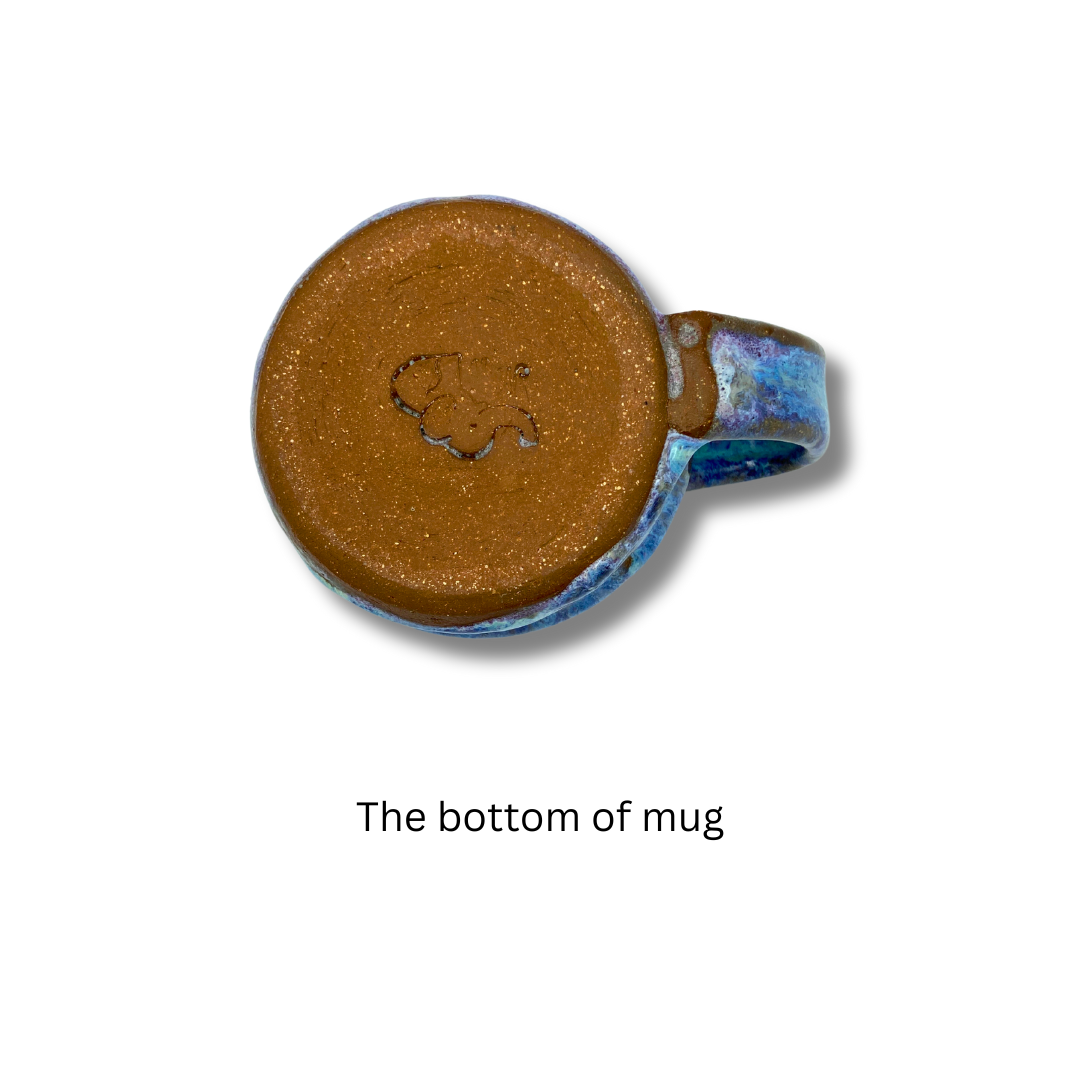 The bottom view of A handcrafted ceramic mug with a blue and purple texture
