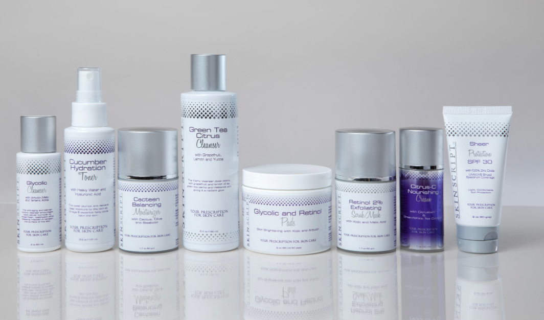 A range of skin care products including cleansers, exfoliating scrubs, pads, toners, creams, and moisturizers from SKINSCRIPTS.