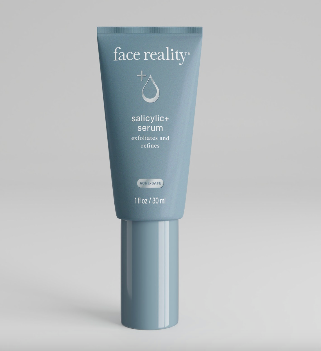 A tube of Face Reality Salicylic+ Serum with product information and branding visible.