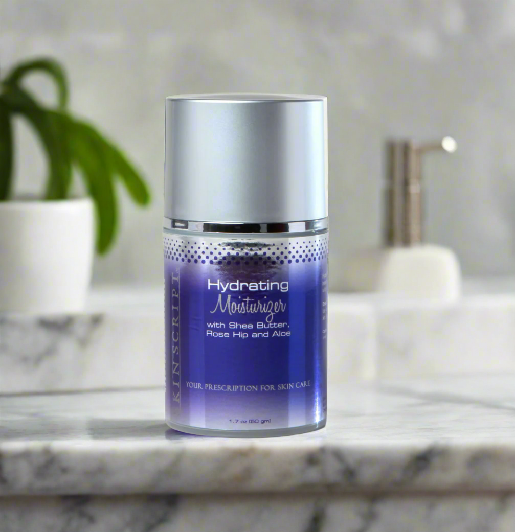 A jar of SKINSCRIPTS Hydrating Moisturizer with a white and blue label, placed on a marble surface with a plant in the background.